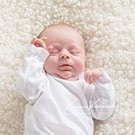 Newborn baby sleeping by Sue Kennedy Photography