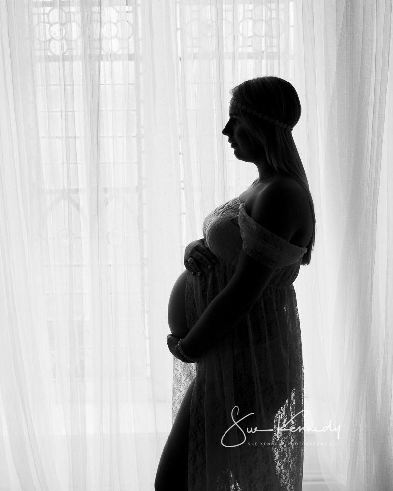 Bump photo of a lady in profile as silhouette.