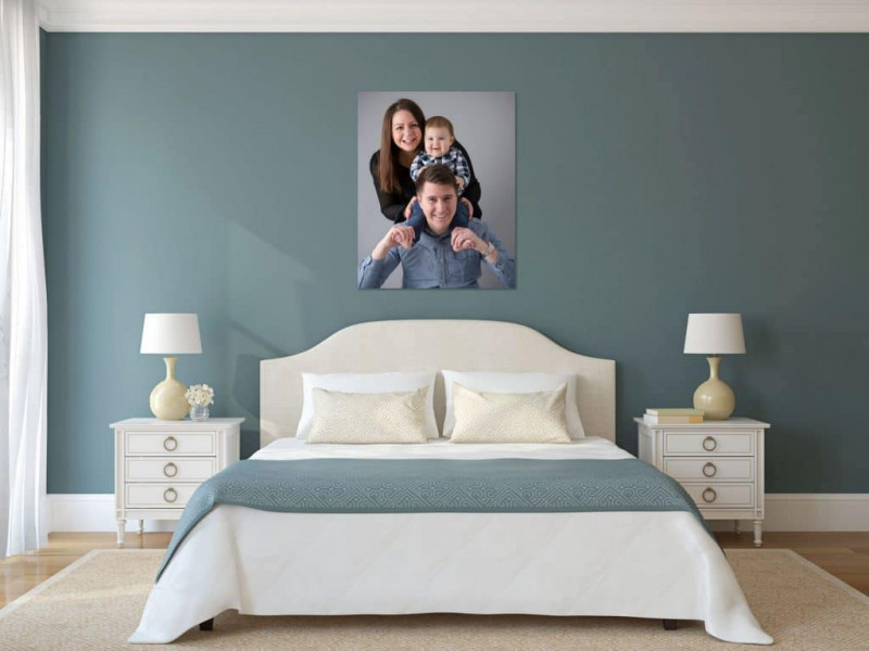Bedroom room set with family portrait over the bed head
