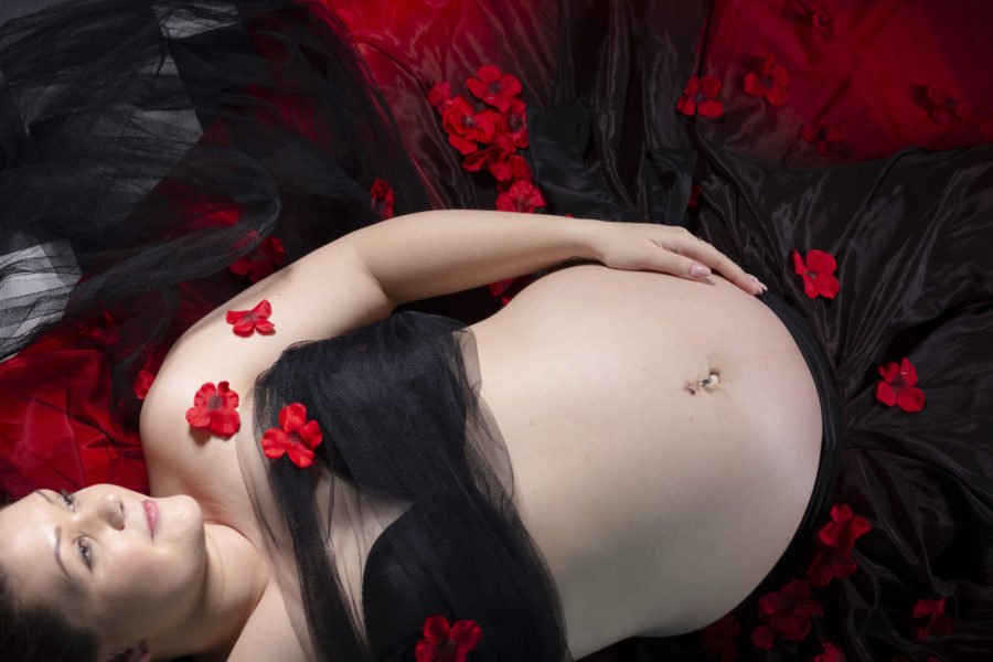 creative bump portrait with red rose petals