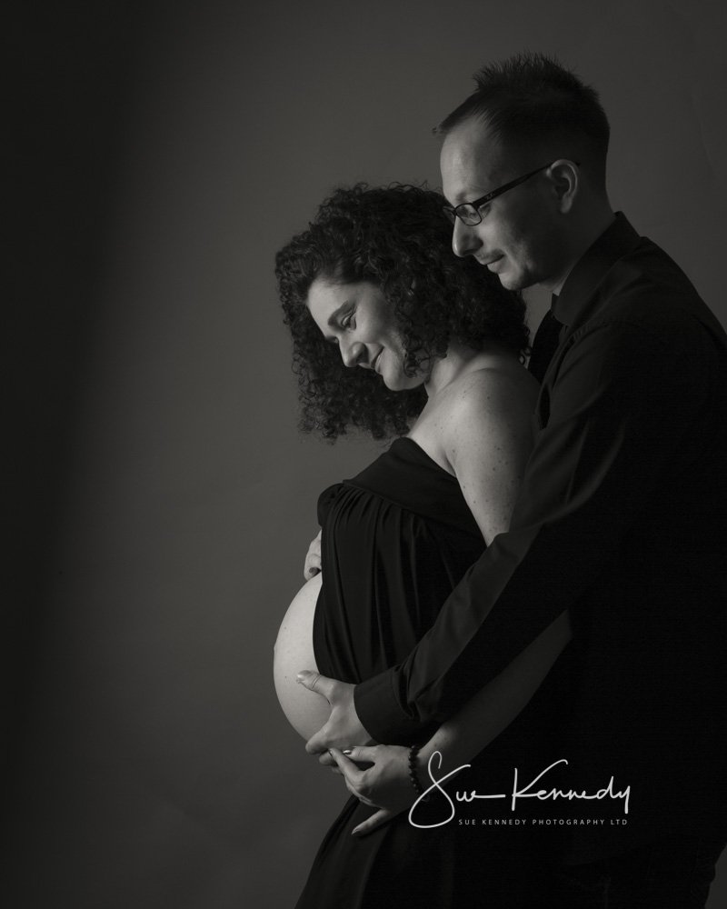 black and white pregnancy portrait of a couple