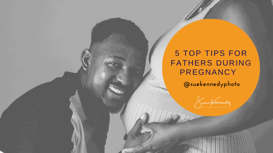 Blog header image showing a smiling Dad to be next to his partners pregnant belly