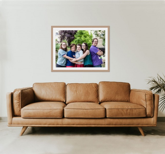 Leather sofa with a framed family photo above