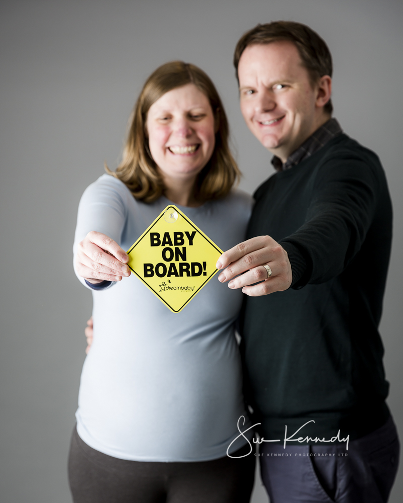 maternity image with baby on board sign