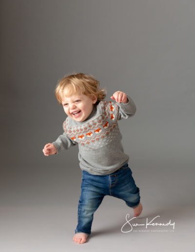 Toddler running and laughing