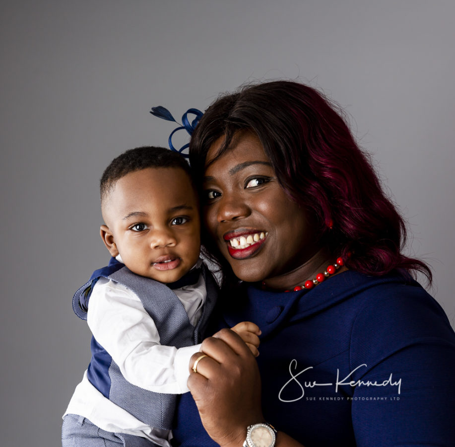 Portfolio photo of toddler boy being held by his mother