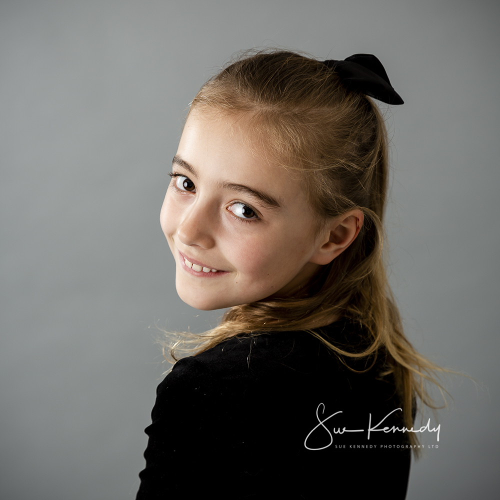 Portrait of a child looking back over her shoulder