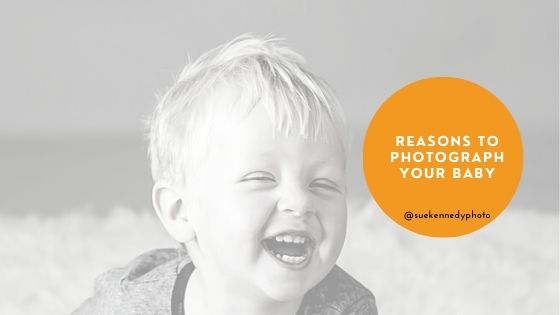blog title image with black and white photo of a boy laughing and the text reasons to photograph your baby