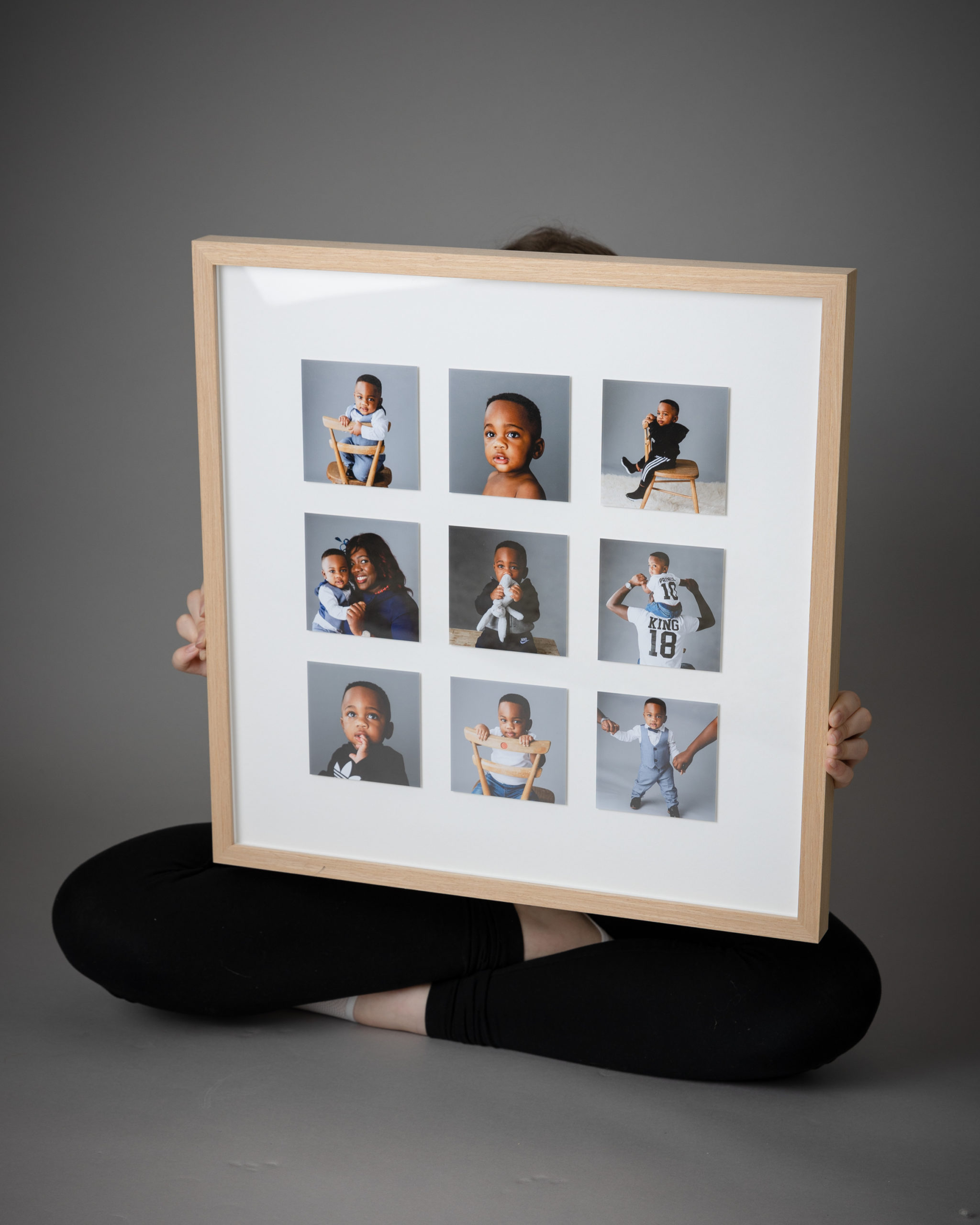 photographed from above of a woman open up a portrait box of prints