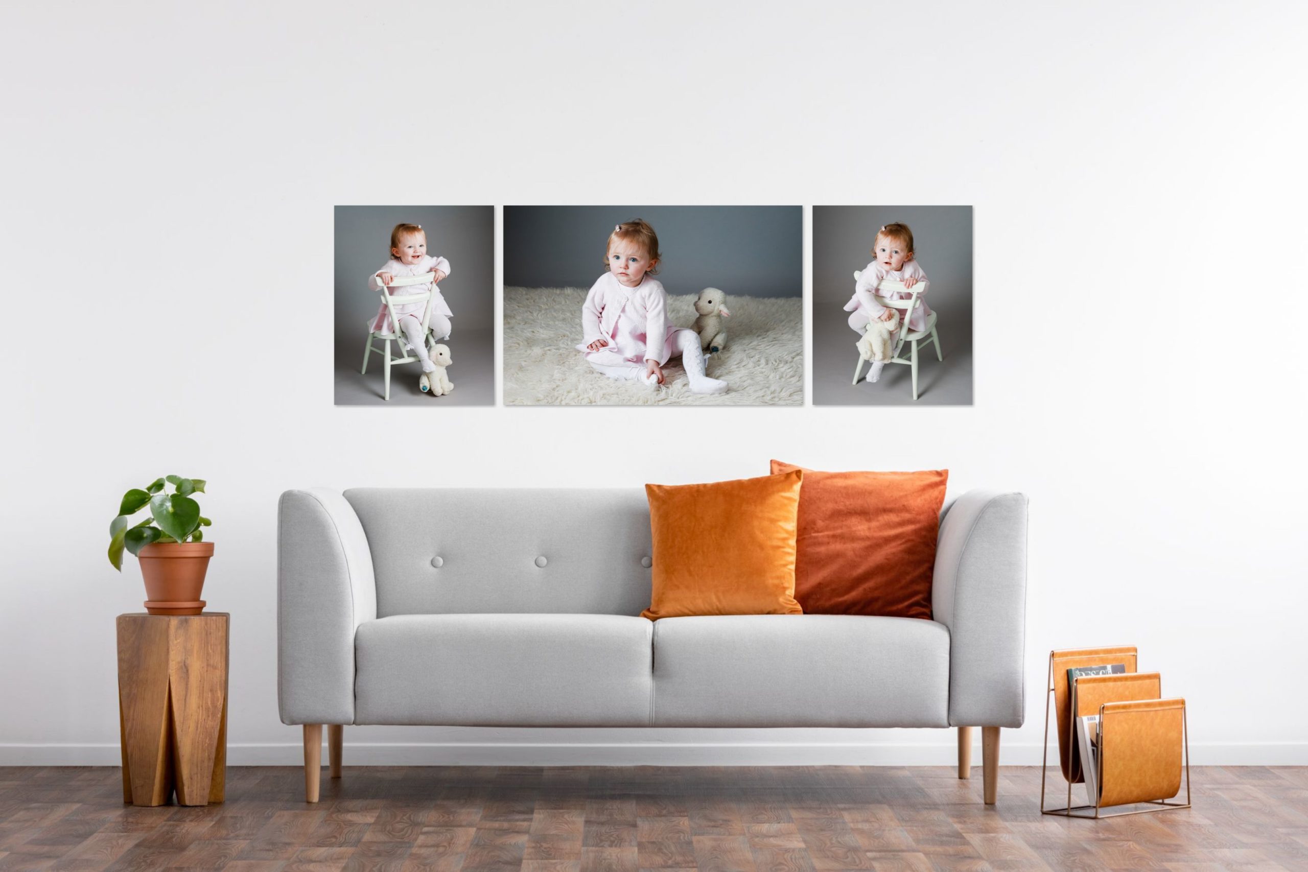 Example of a lounge displaying three canvas prints above a grey sofa