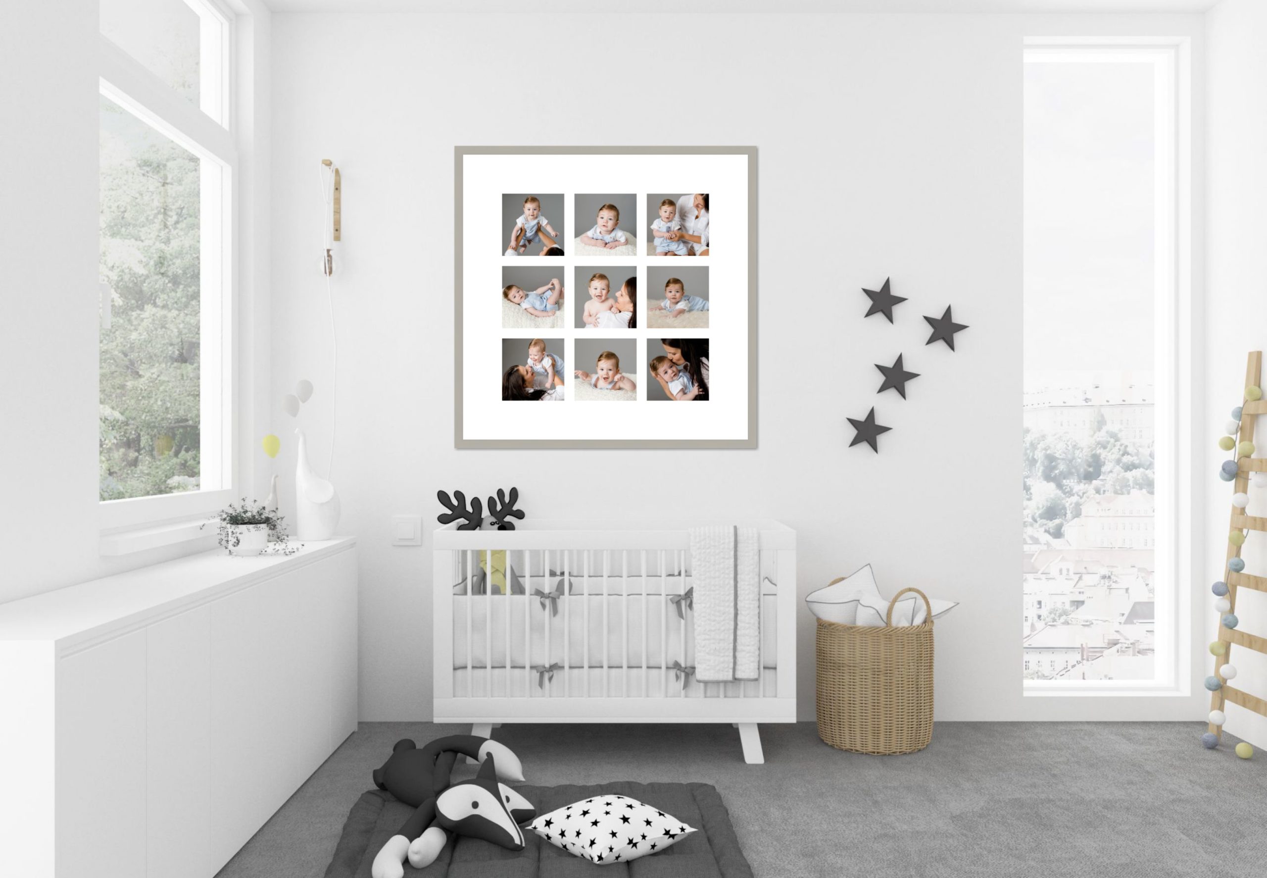 Room scene in white of a baby's room with a large story frame above the cot containing professional images of mother & child.