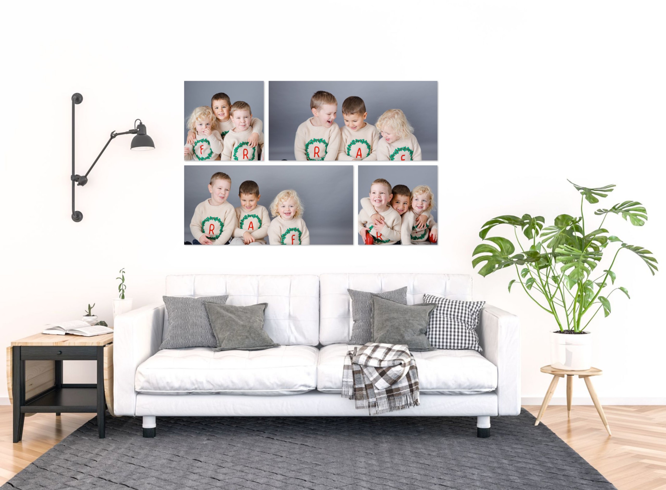 Children’s portrait wall collection displayed above a white sofa, showing a series of framed sibling photographs in a bright living room.