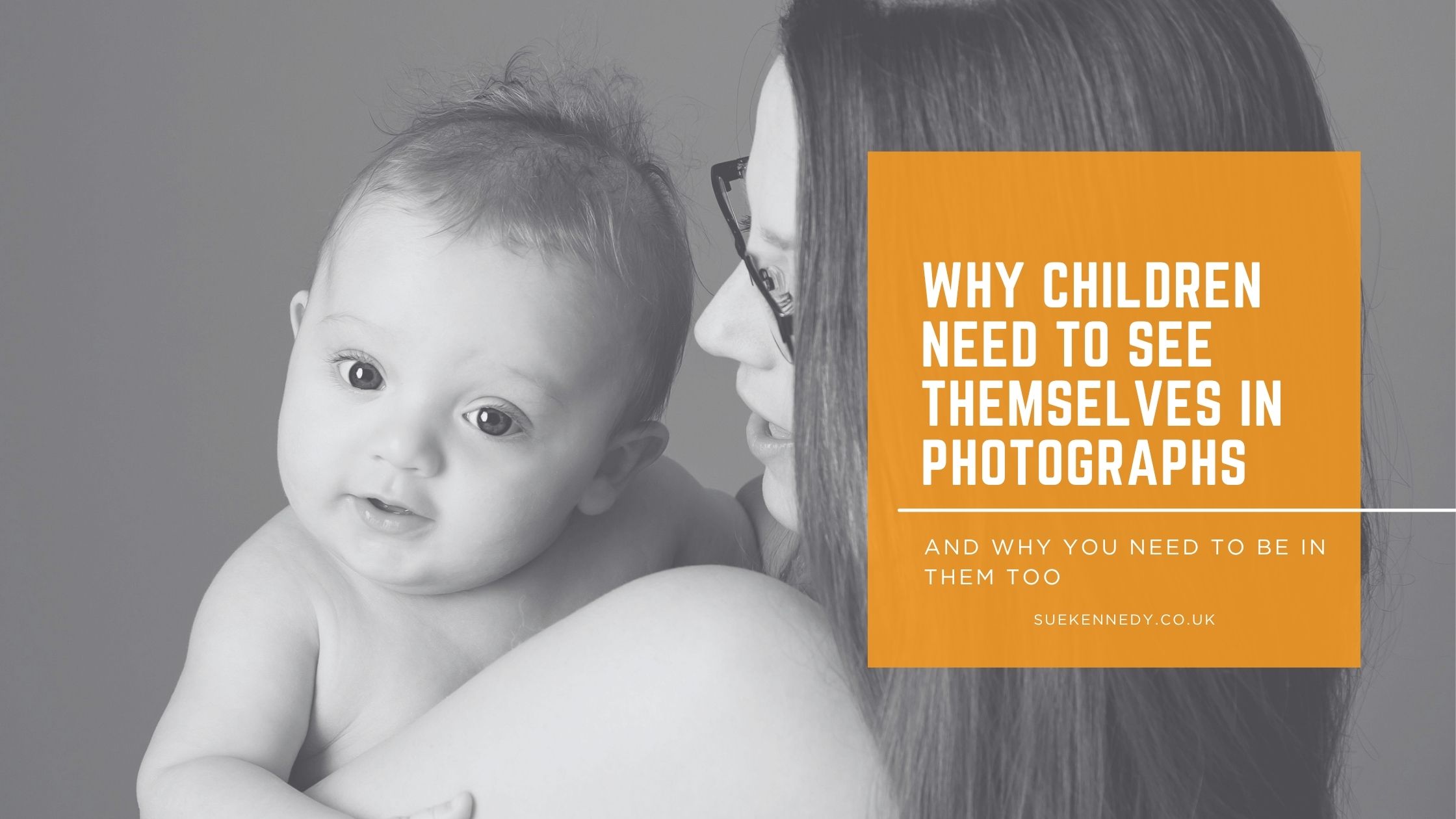 Why Children Need to See Themselves in Photographs A mother holds her baby close, the baby looking directly at the camera — a portrait session at Sue Kennedy Photography illustrating why children need to see themselves in photographs.